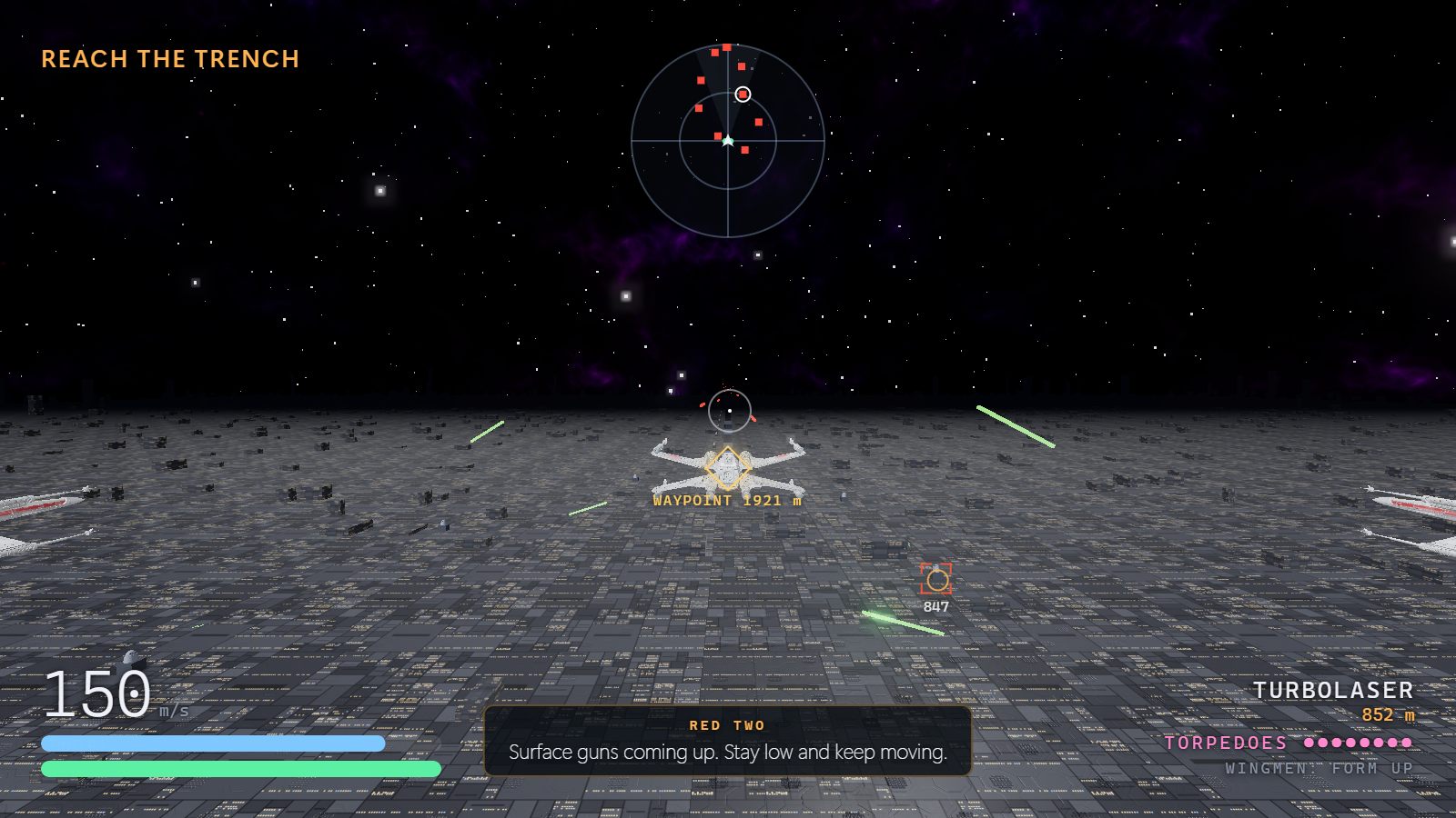 An X-wing skimming the grey panelled surface of a huge space station toward the horizon under a starry sky, green laser bolts from surface guns crossing the frame. The HUD reads REACH THE TRENCH, WAYPOINT 1921 m, a turbolaser 852 m away bracketed in red, and Red Two on the radio: Surface guns coming up. Stay low and keep moving